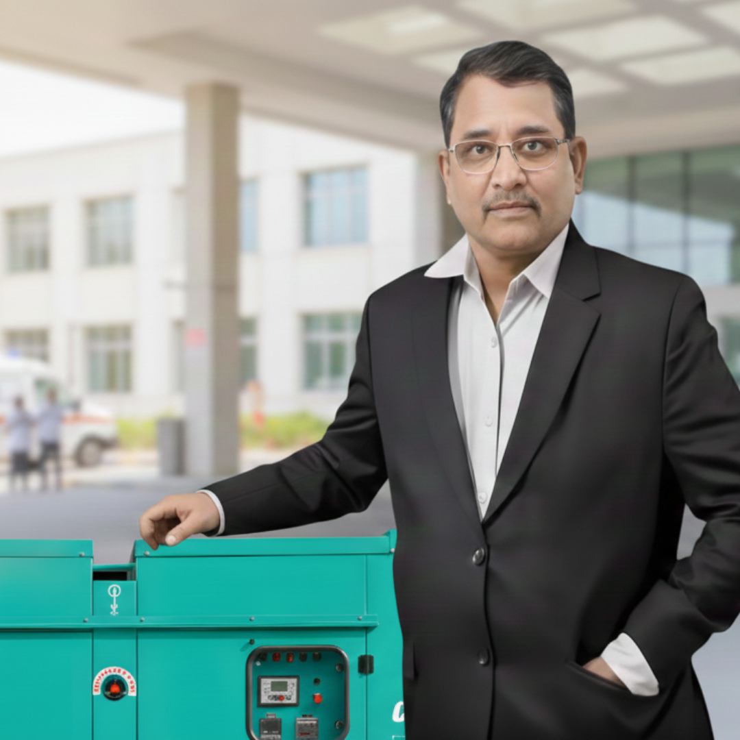 Business owner standing beside an industrial diesel generator representing one of the best diesel generator dealers