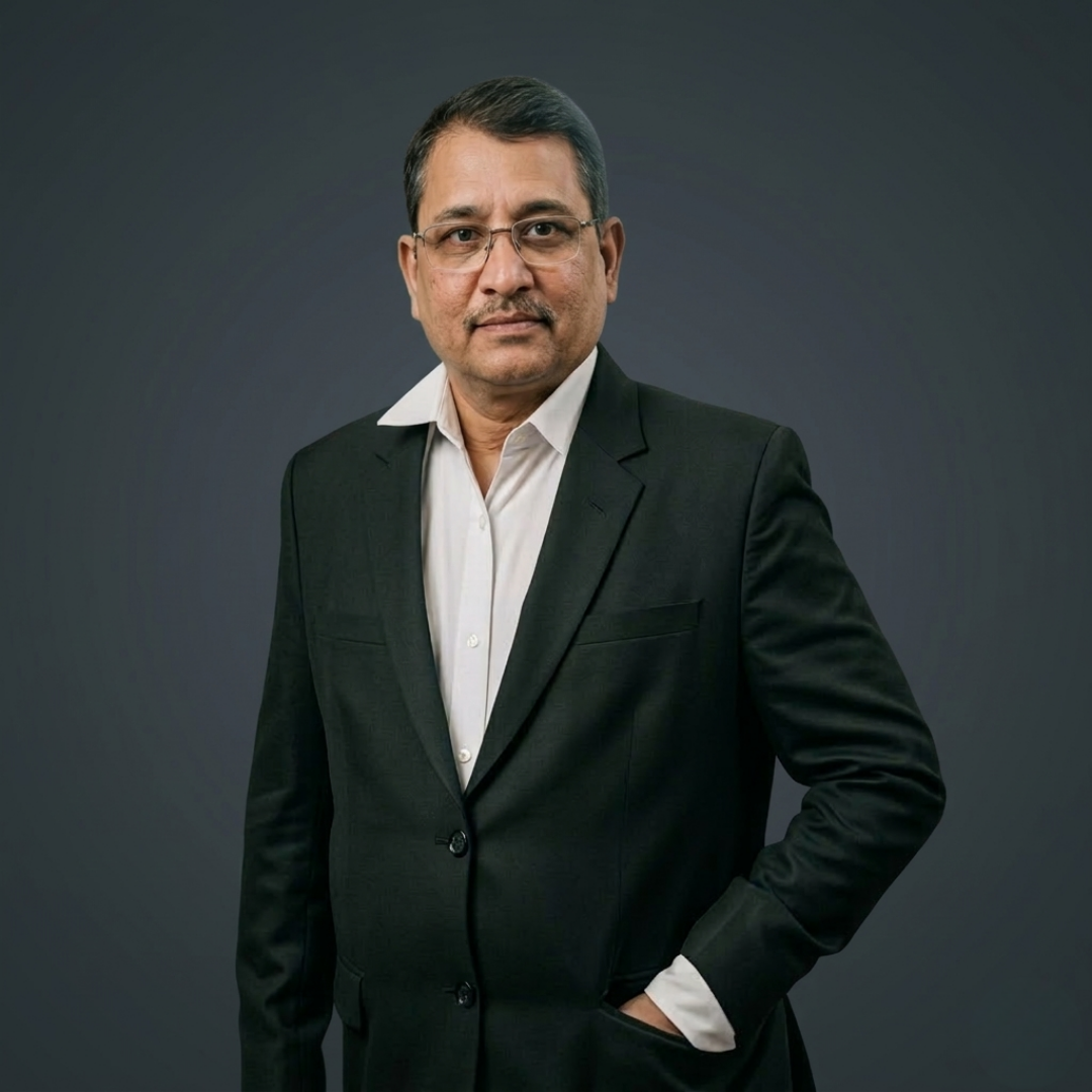 Proprietor of Powergen Engineering standing in formal suit with professional corporate portrait